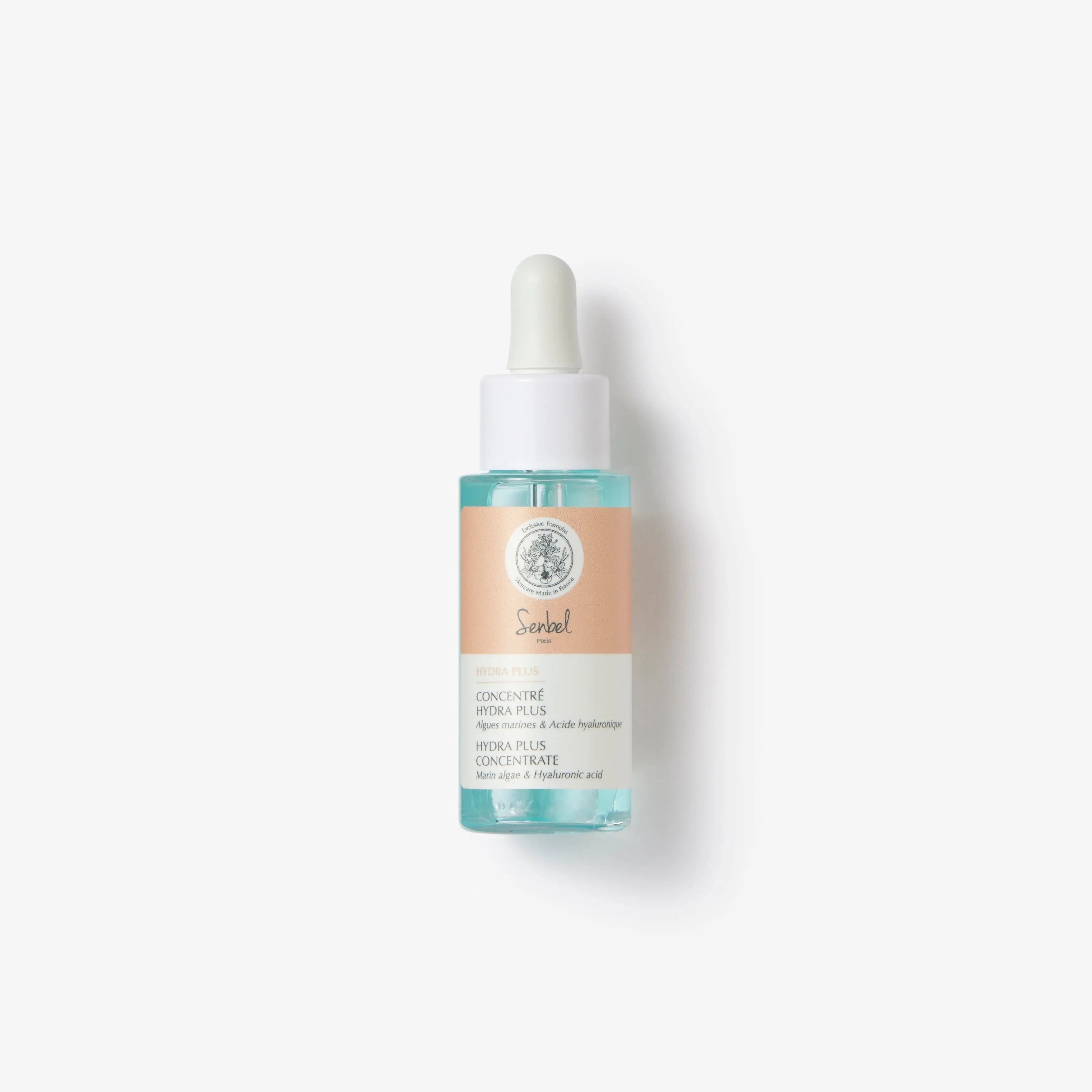 A bottle of Sebel Hydra Plus Concentrate face serum with a dropper, featuring a clear liquid visible inside the bottle and labeled with the product information.